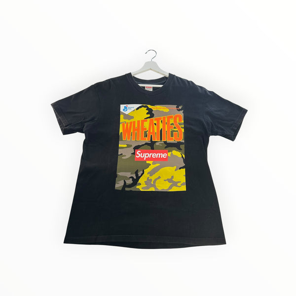 Secondstore black Supreme x Wheaties cotton t-shirt with a yellow and camo graphic print on a white hanger