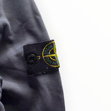 Badge emblématique Stone Island sur la manche d'un sweat à capuche zippé gris en coton de Secondstore