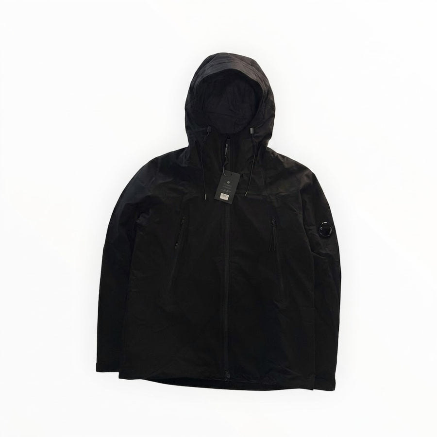 Veste technique noire Secondstore C.P. Company en tissu Pro-Tek avec capuche et lentille emblématique sur la manche